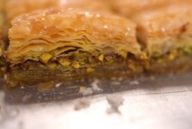 Traditional Turkish dessert Baklava with honey and pistachios