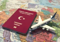 Turkish passport and toy airplane on world map