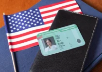 Top view of Green Card, passport, and visa documents